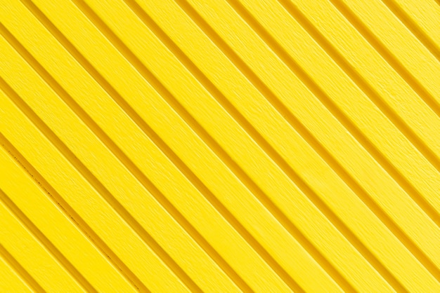 superficie de textura de pared amarilla para el fondo