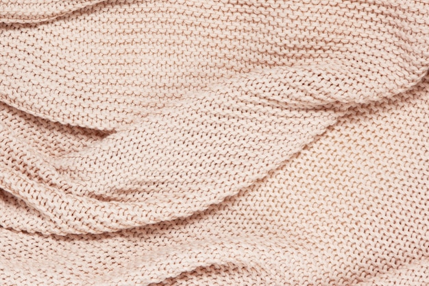 Superficie con textura de tela escocesa de onda de algodón tejido, vista superior, primer plano. Fondo de lana pastel rosa polvoriento suave.