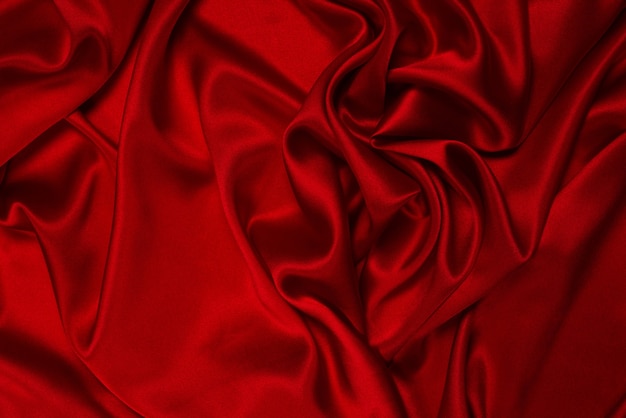 Superficie de textura de tela de seda roja rica y lujosa. Vista superior.