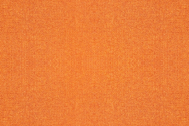 Superficie de textura de tela tejida de color naranja intenso para el fondo