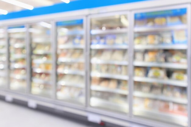 Foto supermercados refrigeradores comerciais congelador mostrando alimentos congelados abstrato fundo desfocado
