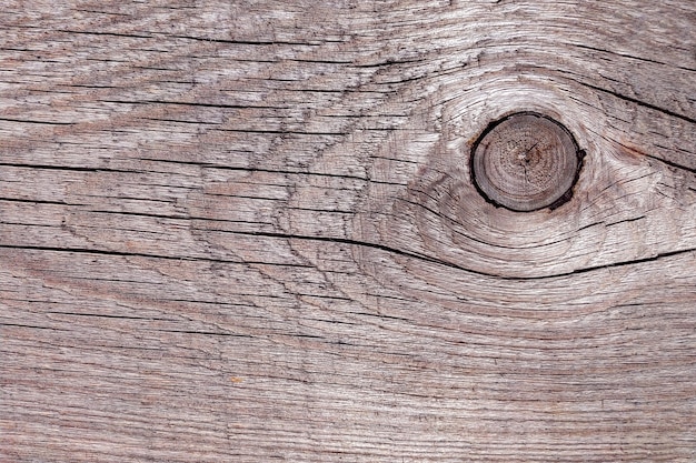 Tablero de madera sin pintar con grietas, valla rústica marrón de textura de madera natural