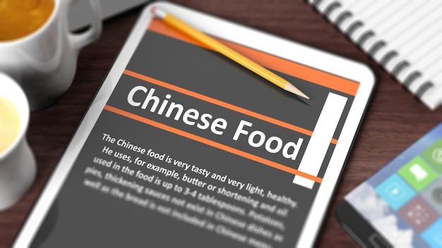 Tablero con varios objetos enfocados en la tableta con texto de comida china en la pantalla