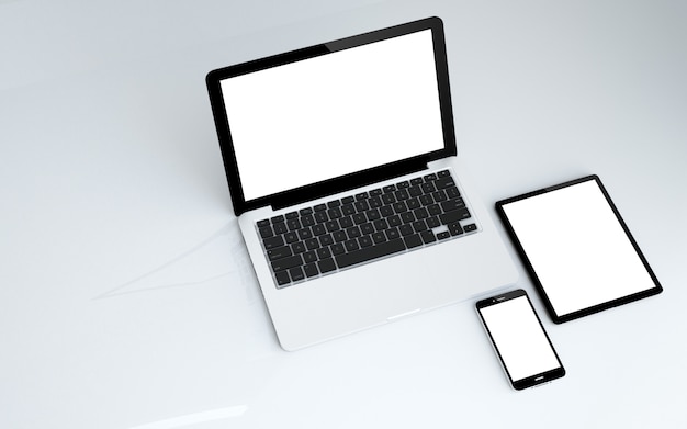 Foto tableta, laptop y smartphone con pantalla blanca.