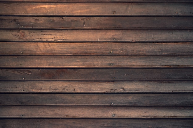 Foto tablón de madera marrón oscuro de la vieja tradición de la casa para el fondo de textura de madera