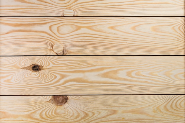 Tablones de madera de pino sin pintar con nudos. Textura de tablón de madera para su fondo.