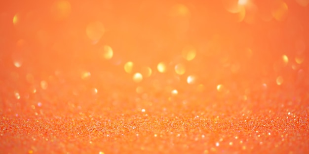 Foto tamanho de fundo do banner luzes de desfoco são amarelas e laranjas glitter desfoco