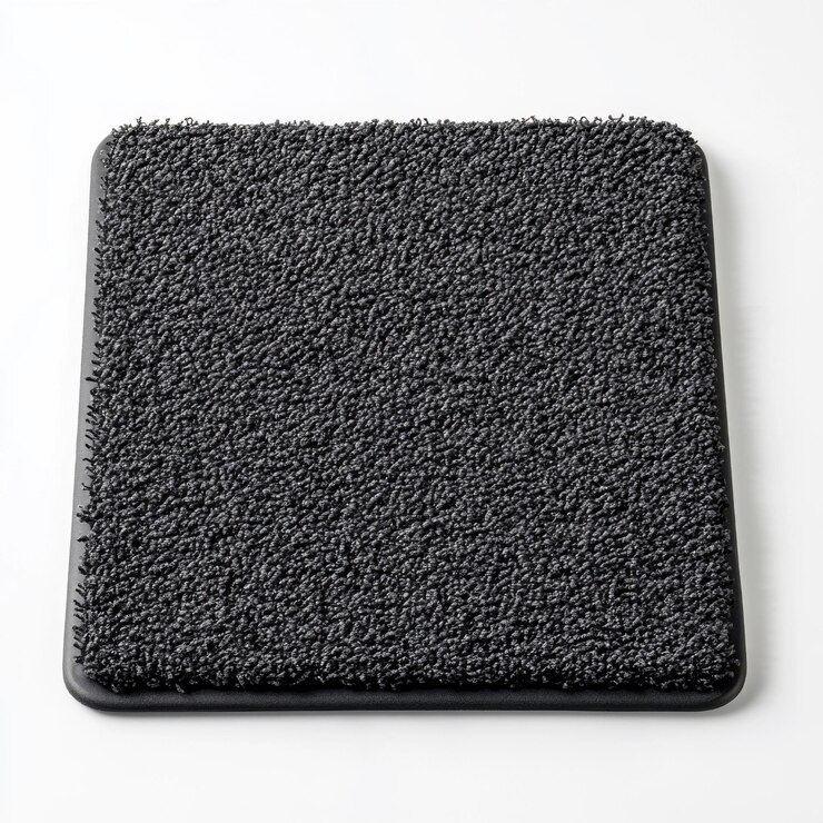 Foto tapete de porta de textura quadrada preta em fundo branco para decoração doméstica