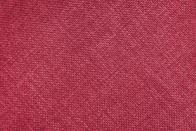 Tapicería de tejido jacquard de color rojo brillante textura de tejido grueso con líneas de tejido diagonal de cerca