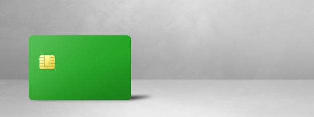 Tarjeta de crédito verde sobre un fondo de hormigón blanco