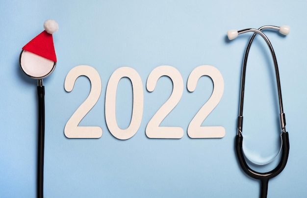 Tarjeta de felicitación de invierno médico de Navidad y año nuevo 2022