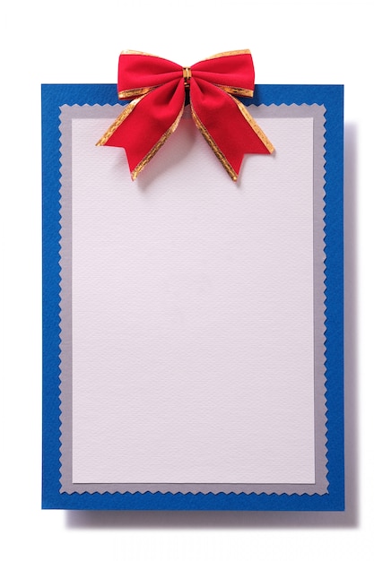 Foto tarjeta de navidad en blanco arco rojo decoración vertical