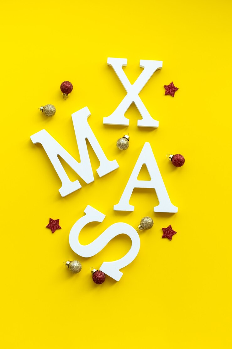 Foto tarjeta de navidad letras de navidad blancas sobre fondo festivo.