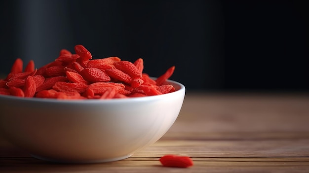 Un tazón de bayas de goji en una mesa de madera.