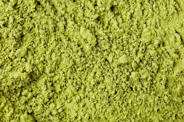 Té matcha. Primer plano de polvo verde de textura de fondo. Macro, vista superior