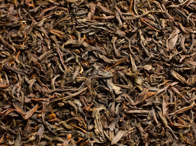 Té seco con pétalos de flores como espacio de copia de vista superior de fondo