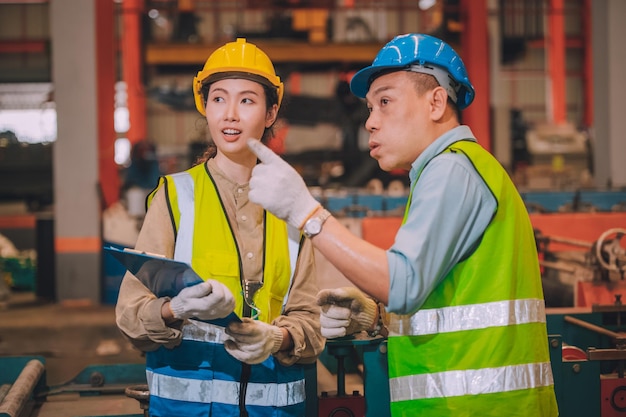 Team Asian Engineer Working Control Machine in Factory Group People Asia Worker Control Machine with Manufacturing of Industry