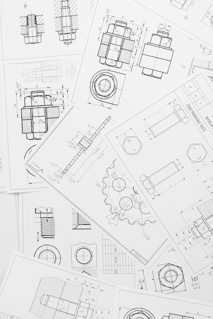 Foto technischen zeichnungen von industriellen teilen und mechanismen auf papier