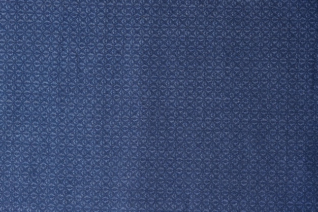 Tecido azul com padrão geométrico como pano de fundo azul têxtil com ornamento fechado