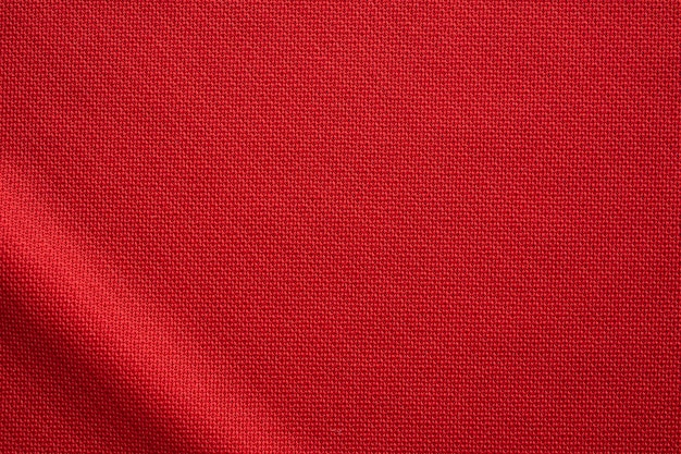 Tecido vermelho para roupas esportivas com textura de camisa de futebol close-up