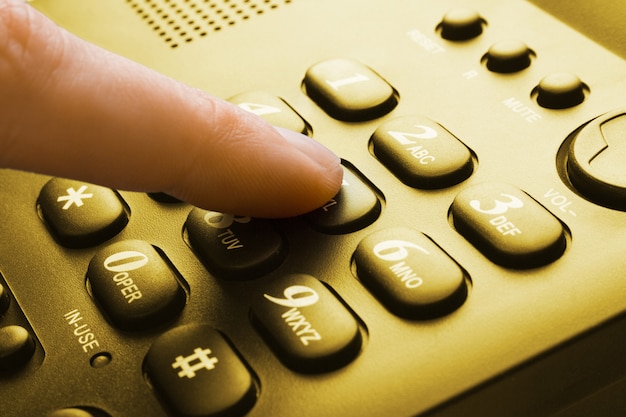 Teclado del teléfono sepia con presionar con el dedo