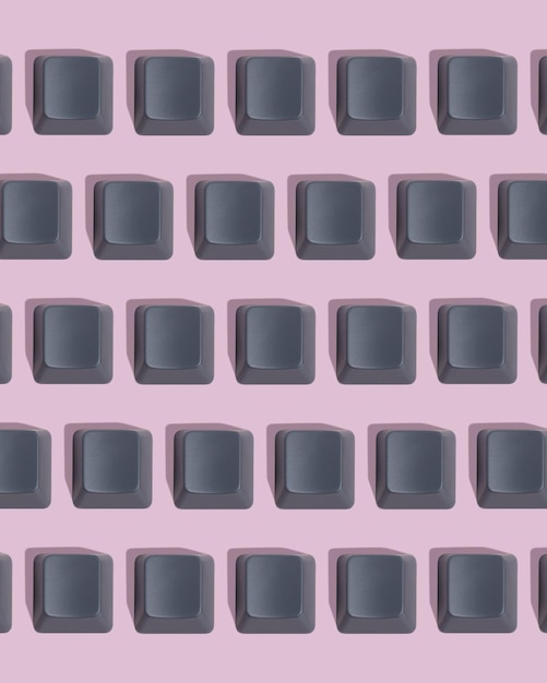 Teclas de teclado gris en blanco sobre fondo rosa Espacio de patrón para texto