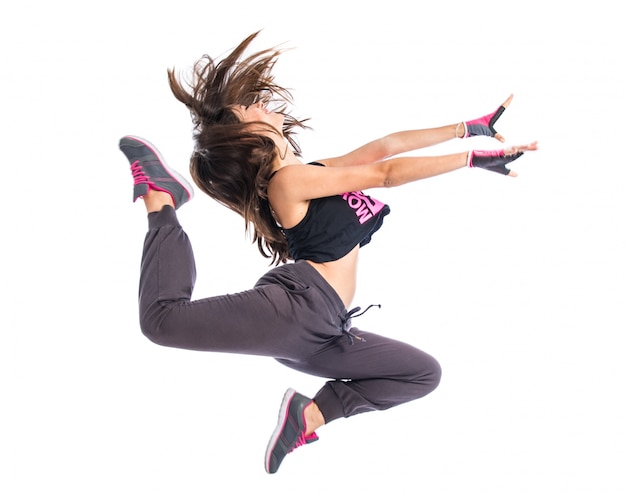 Teenager girl jumping in hip hop style