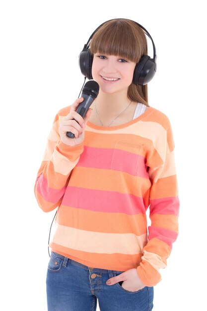Teenager-Mädchen mit Kopfhörern und Mikrofon isoliert auf weißem Hintergrund