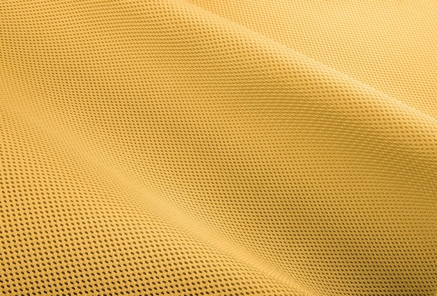 Foto tejido amarillo áspero textura tela de algodón tejido de punto moderno impermeable materiales flexibles de control de temperatura textil multifuncional inteligente de primer plano enfoque selectivo no se desgarra