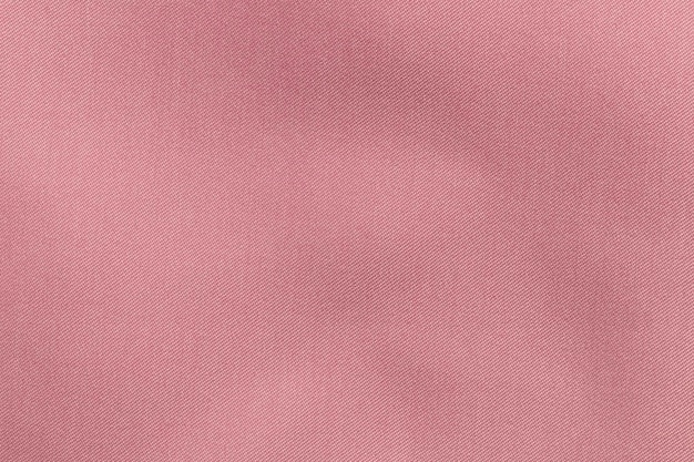 Tejido de color rosa, textura de poliéster y fondo textil