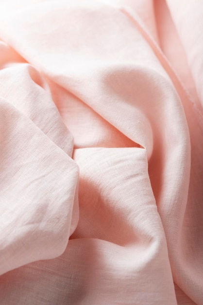 Tejido de lino ondulado en imagen de enfoque selectivo de color pétalo rosa