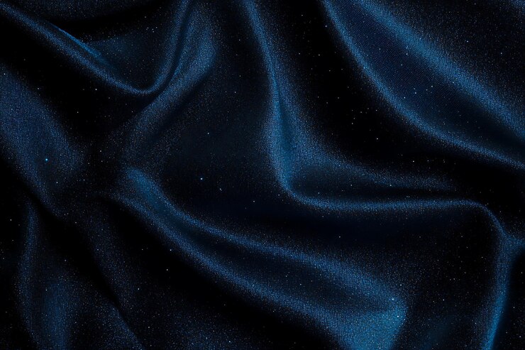 Tejido de satén azul con chispas