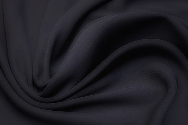 Tejido de seda, cadi, color negro en el diseño artístico.