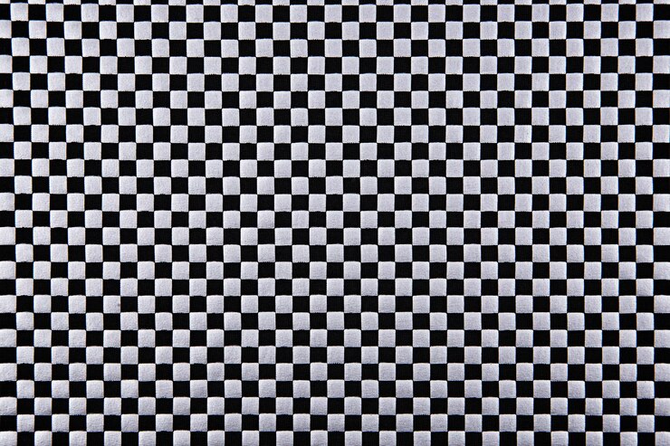 Foto tejido de tablero de ajedrez blanco y negro de fondo o textura