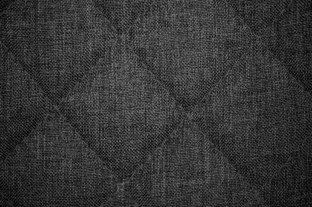 Tejido de textura. Fondo de tela de punto gris oscuro.