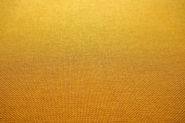 Tejidos de algodón simplemente algodón Industria textil Textura de lino naranja de moda Fondo de tela natural Patrón de tela de saco crudo ecológico Burlap lienzo orgánico Textura fondo de lino amarillo brillante