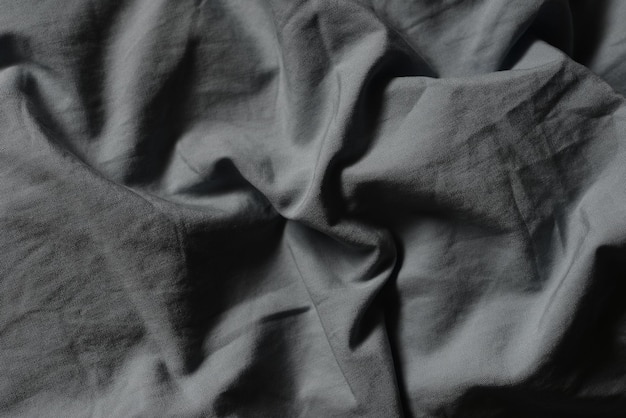 Una tela gris con un patrón en espiral.