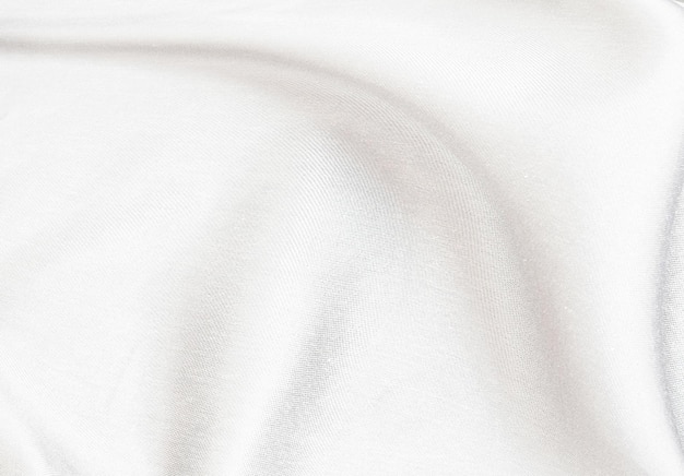 Foto tela de seda blanca suave y elegante o textura de tela satinada de lujo para un fondo abstracto