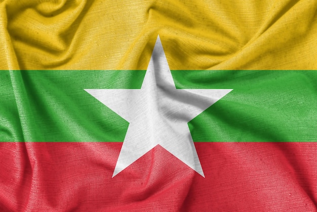 Tela de seda realista del fondo de la bandera del país de Myanmar