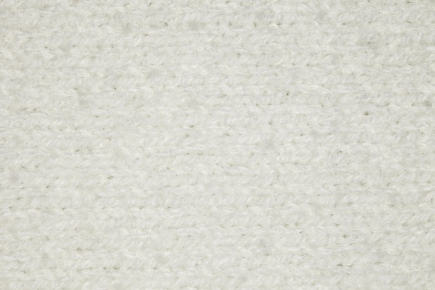 Foto tela tejida con hilos de lana de oveja blanca primer plano fondo papel tapiz patrón de textura uniforme