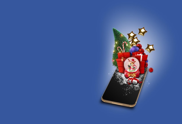 Teléfono celular sobre fondo azul árbol de navidad presenta globos en forma de estrellas doradas globo de nieve puede ...