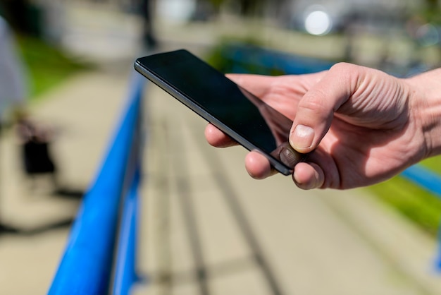 Foto teléfono inteligente en la mano