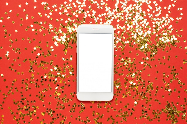Teléfono móvil con confeti de estrellas doradas