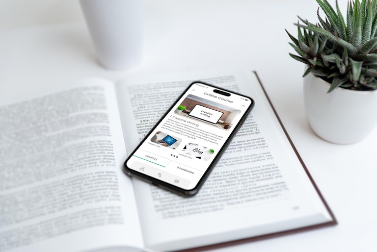 Foto el teléfono muestra una aplicación de cursos en línea en un libro que simboliza la educación en escritura creativa ideal para visuales en aprendizaje digital habilidades de escritura cursos en línea y herramientas educativas