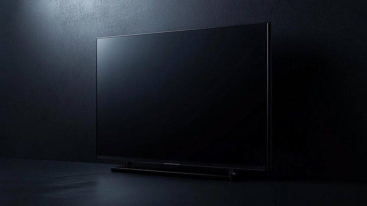 Televisión moderna en una superficie oscura elegante contra una pared negra con textura en un entorno minimalista