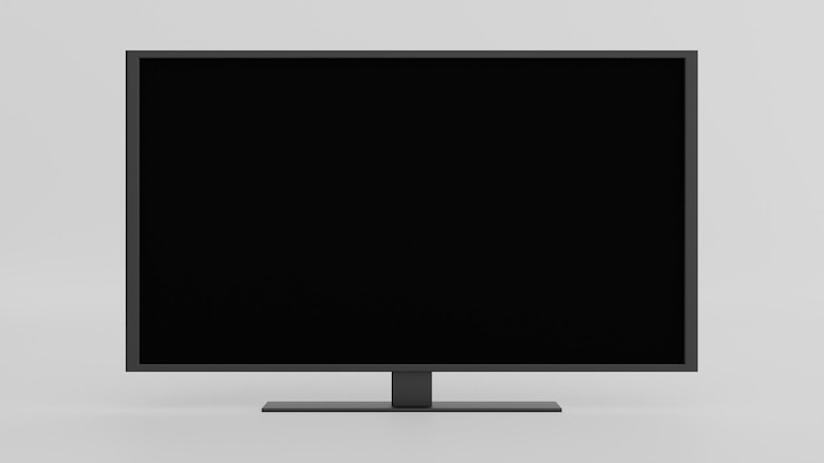 Foto un televisor de pantalla plana sentado en la parte superior de una mesa