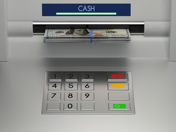 Terminal de caixa eletrônico com notas de dinheiro em dinheiro no slot e teclado