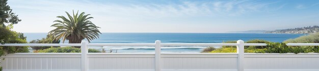 terraza con valla blanca de madera con vistas al océano