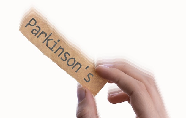 Text zur Parkinson-Krankheit auf Papier auf weißem Hintergrund