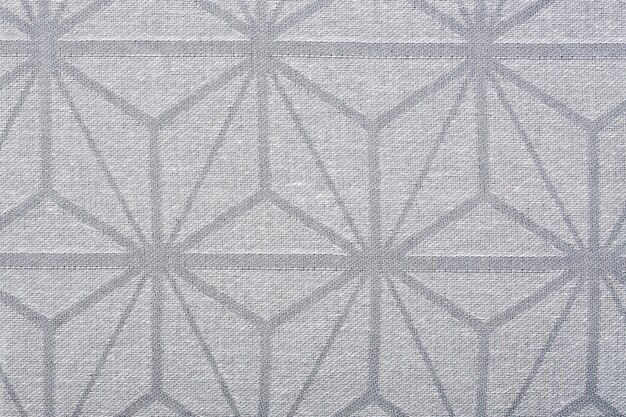 Textil gris con un patrón abstracto, un fondo o una textura